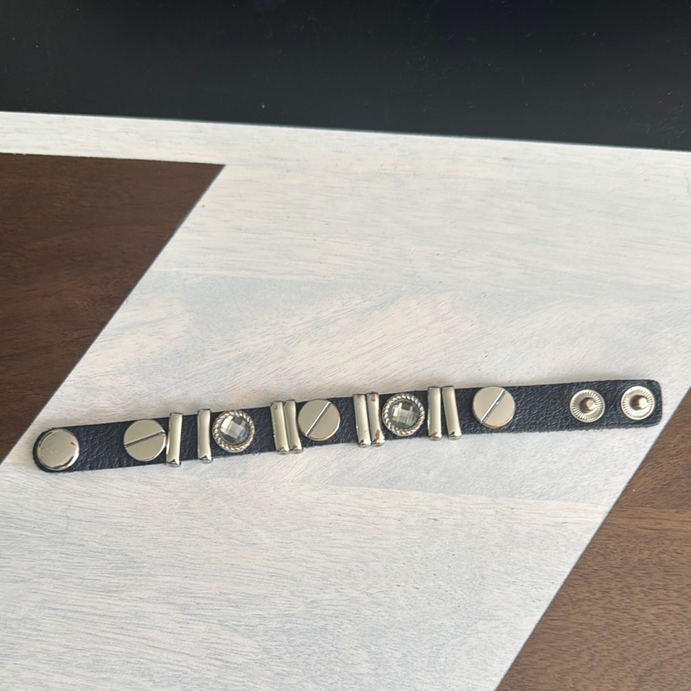 Black leather silver bar/gray faceted crystal/slotted disc snap closure bracelet